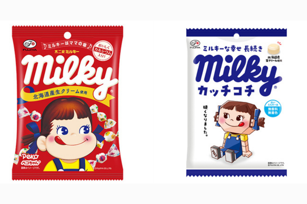 Regular soft Milky candies on the left (red and white packaging) and hard Kacchi Kochi Milky candies on the right (white and blue packaging).